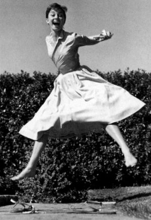Audrey Hepburn laughing and jumping - mylusciouslife.com.jpg